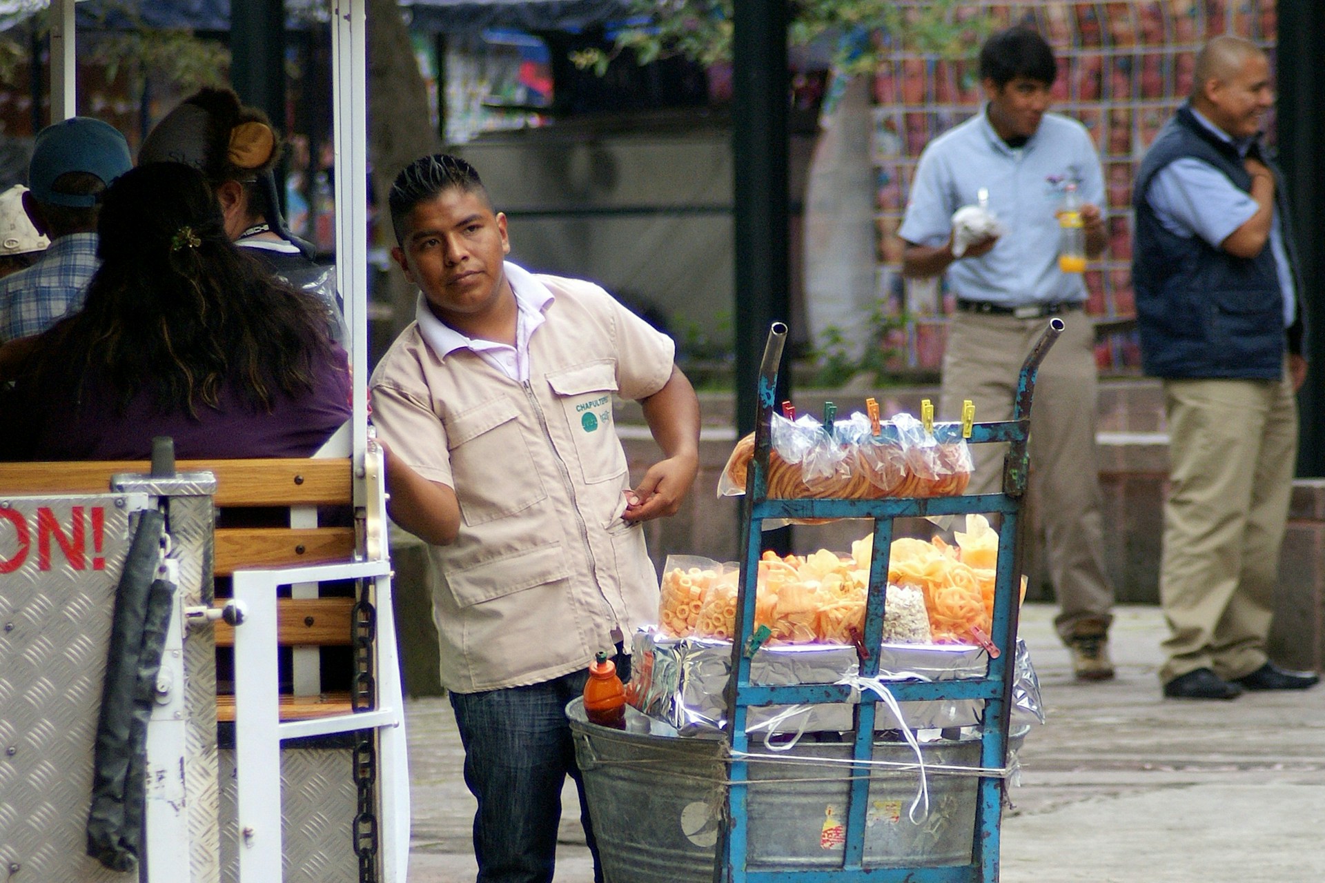 man in white button up shirt standing beside woman in blue denim jeans