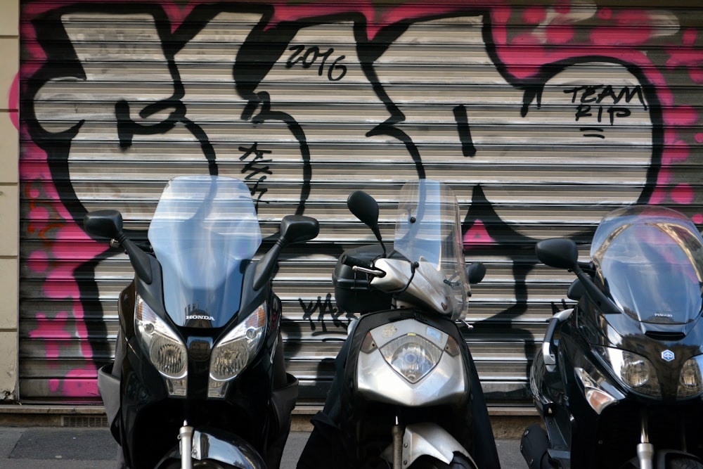 black and silver motorcycle on black and white wall