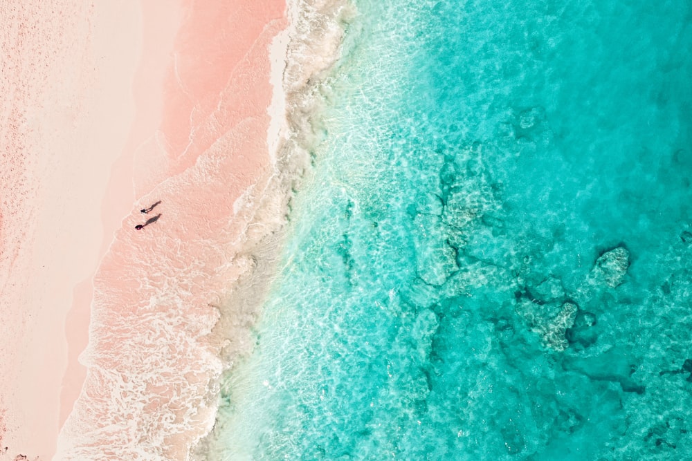 aerial view of person surfing on sea waves during daytime