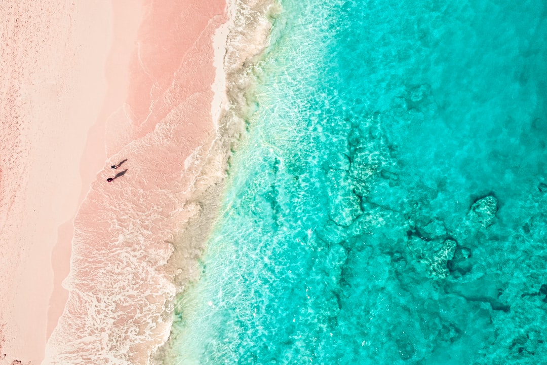 aerial view of person surfing on sea waves during daytime