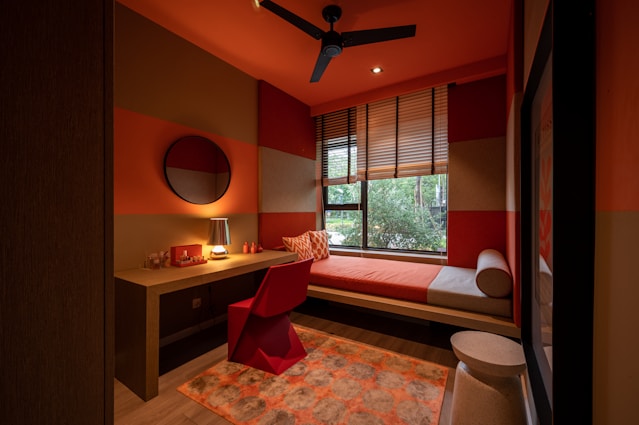 brown wooden table and chairs near window