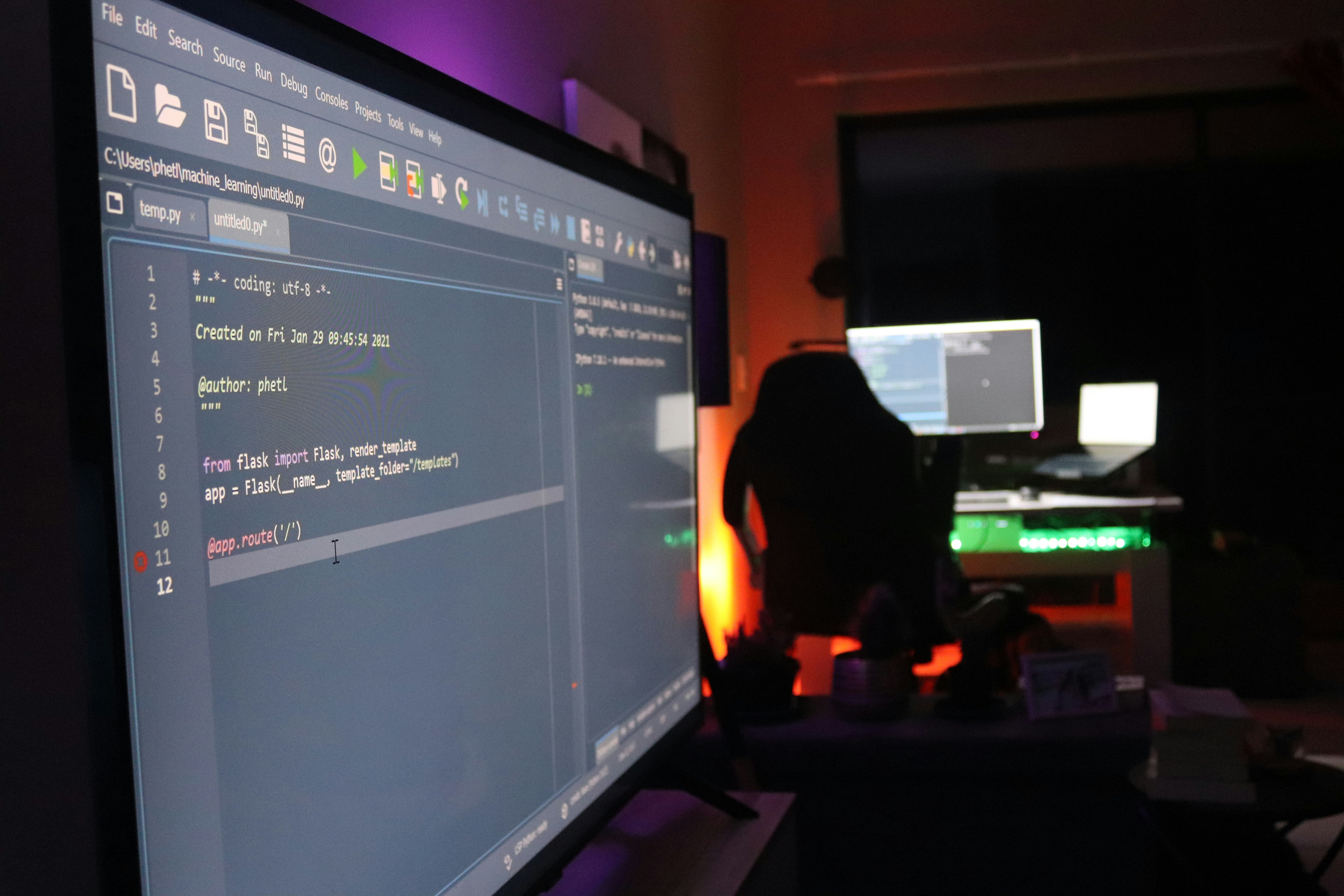 Python code on bright laptop screen with clean white background and natural daylight