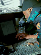 A contractor reviewing corrected business details on a laptop at a job site