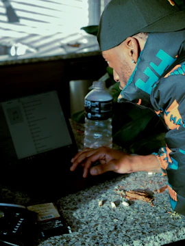 A contractor reviewing corrected business details on a laptop at a job site