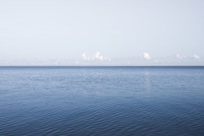 blue sea under blue sky during daytime
