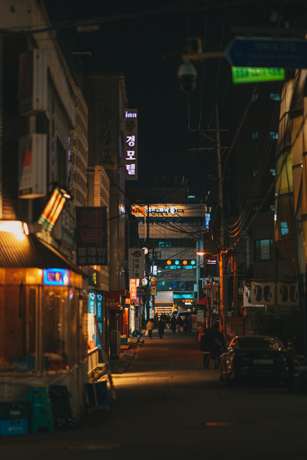 cars parked on side of the road during night time