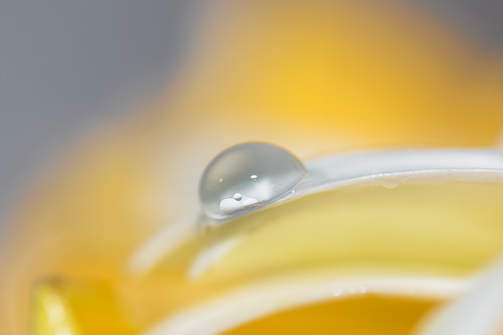 white ceramic spoon on yellow liquid