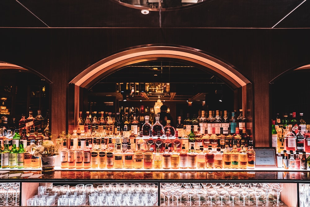 brown wooden shelf with bottles