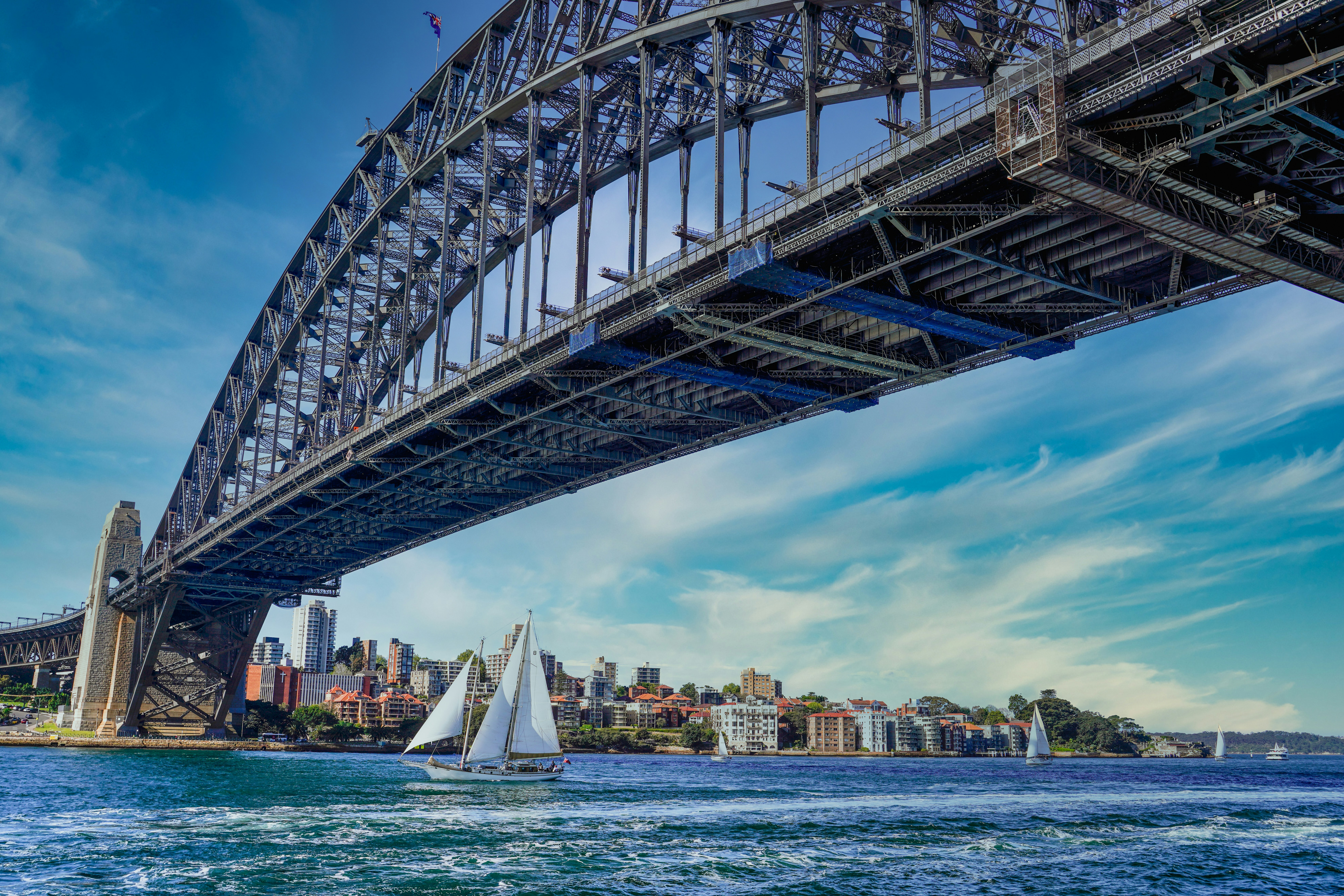 white sail boat on sea under blue sky during daytime