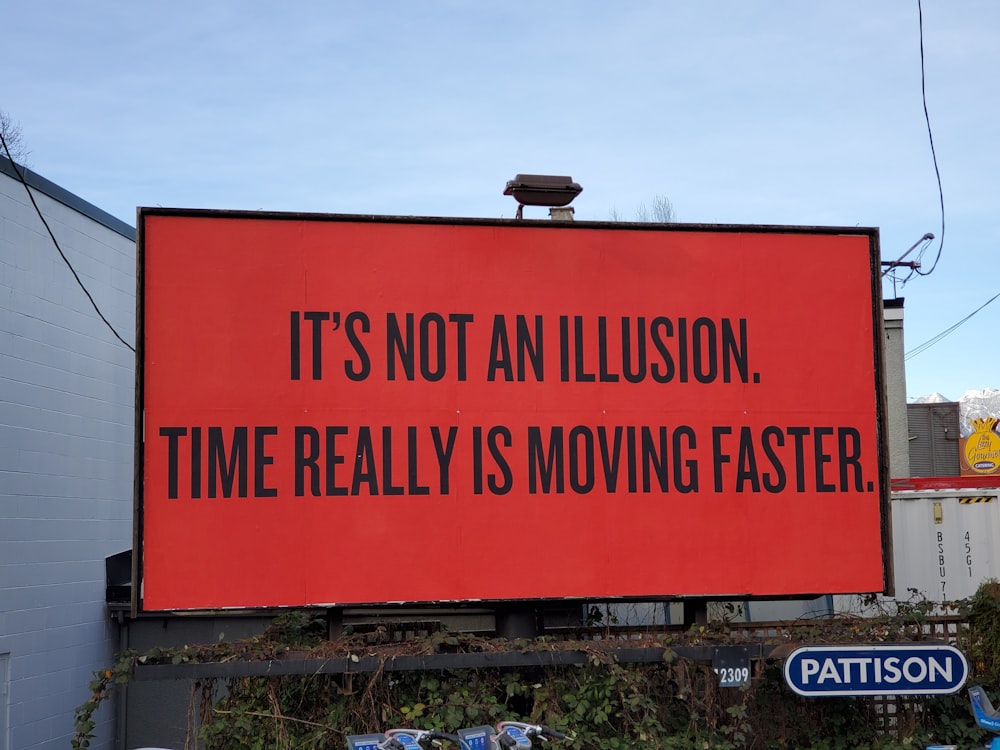a large red billboard with a quote on it