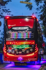 A vibrant party bus with colorful lights and passengers enjoying the ride.