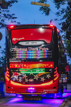 Close-up of a vibrant LED advertising screen inside a city bus showing colorful brand content