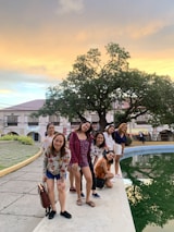 A happy family enjoying their pool, with jps branding visible on a service van in the background.