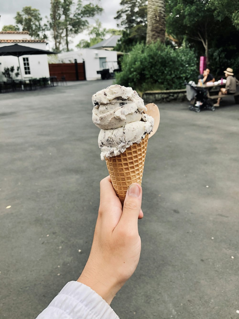 person holding ice cream cone