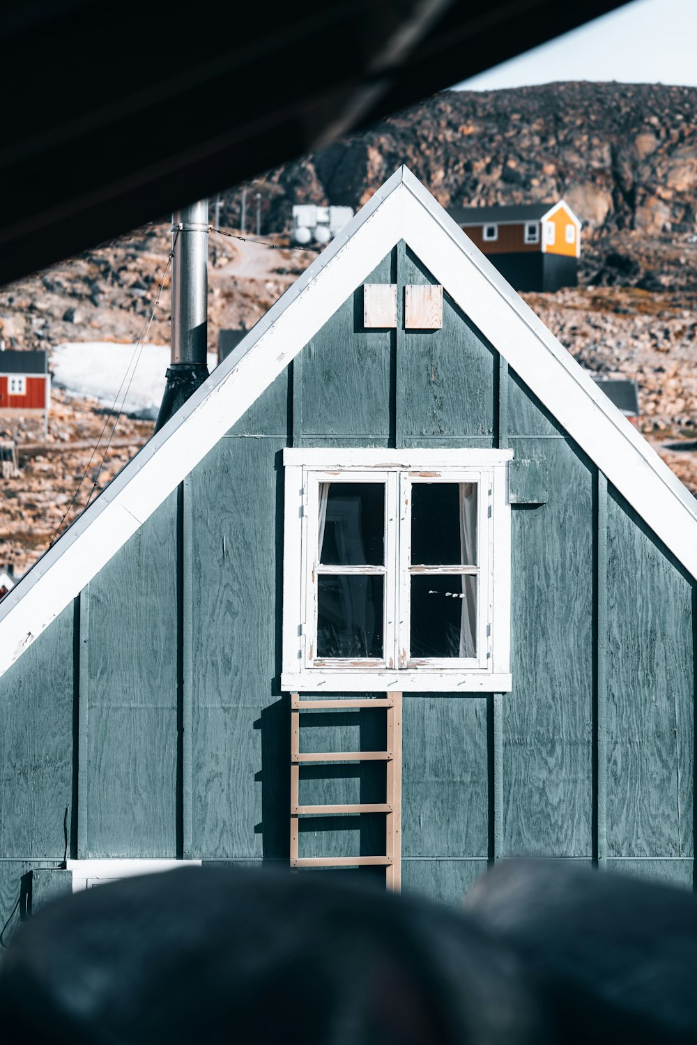 white wooden house with brown roof