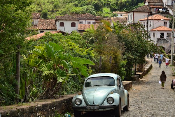 A Beetle parked on a steep cobbled street — Ouro Preto, Brazil
