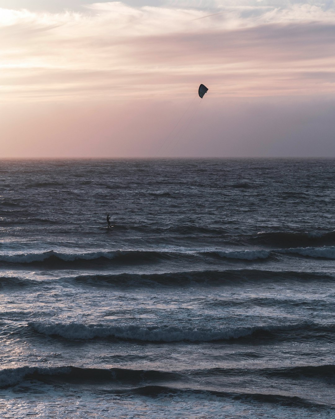 person in water during sunset