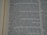 A close-up image of a book page with text in a serif font. The text appears to be a narrative passage, with focused lines in the center and slightly blurred lines at the top and bottom, indicating a depth of field effect.