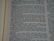 A close-up image of a book page with text in a serif font. The text appears to be a narrative passage, with focused lines in the center and slightly blurred lines at the top and bottom, indicating a depth of field effect.