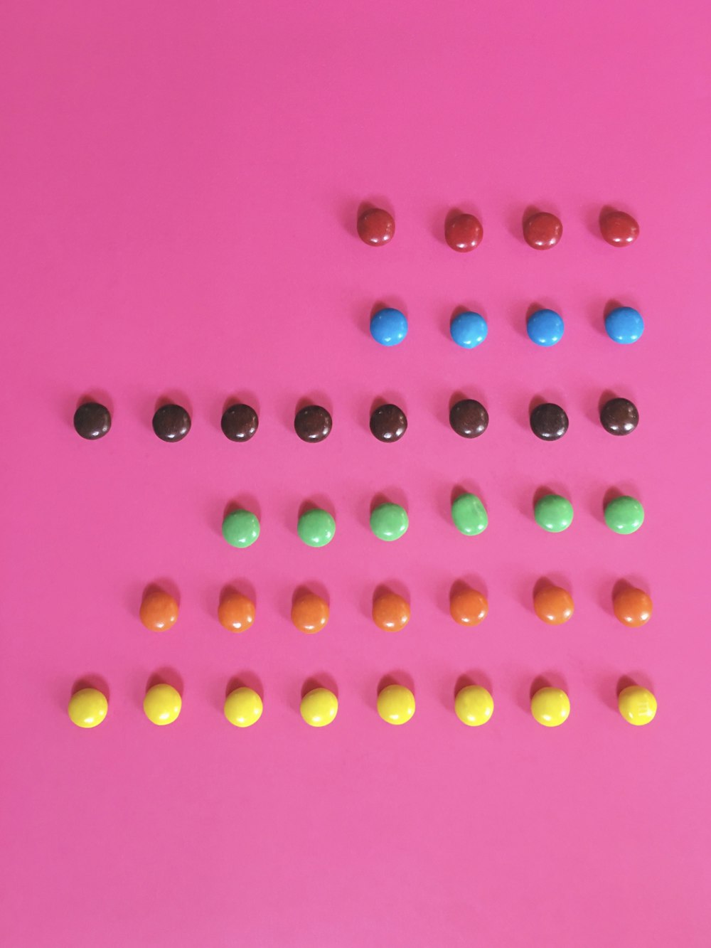 pink and yellow round beads