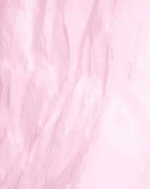 Close-up of delicate pink pastel fabric texture representing the softness and care of menstrual underwear.