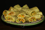 A vibrant spread of fresh, colorful salads and wraps arranged for a corporate meeting.