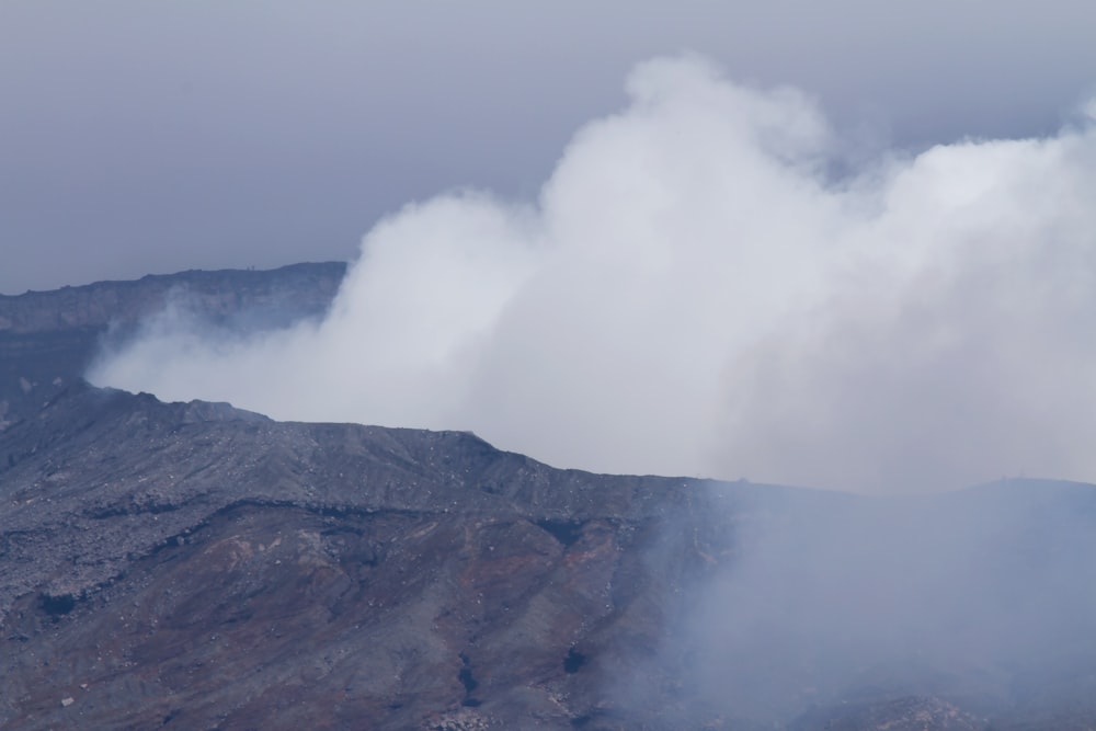 gray mountain under white clouds