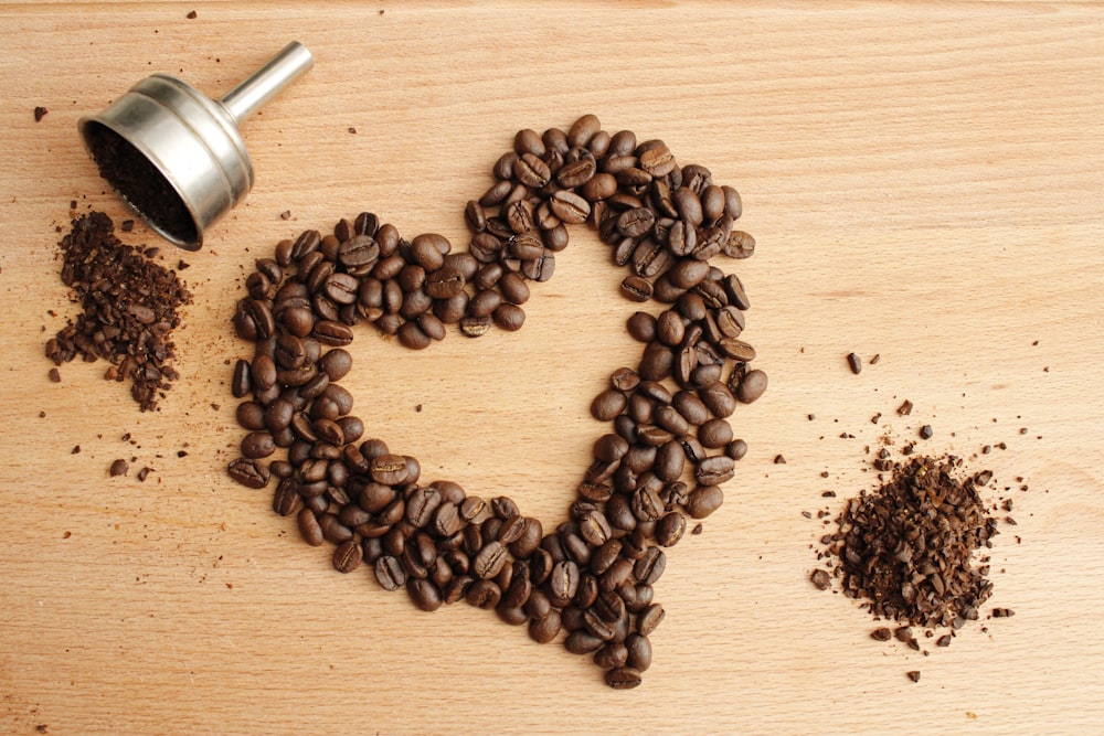 black coffee beans on brown wooden table