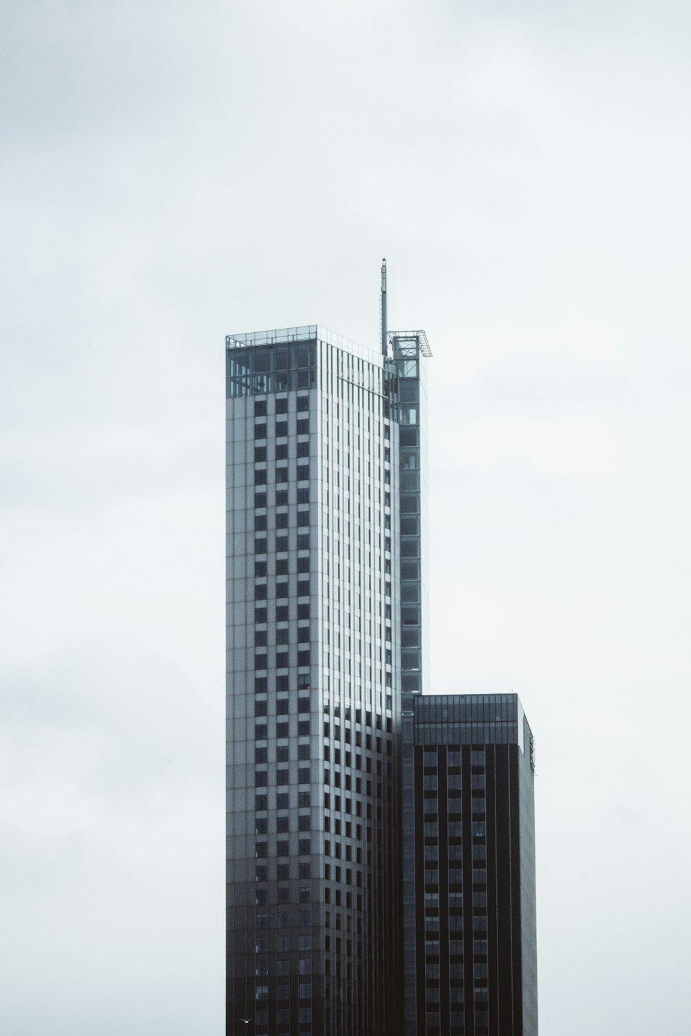 gray concrete building under white sky during daytime