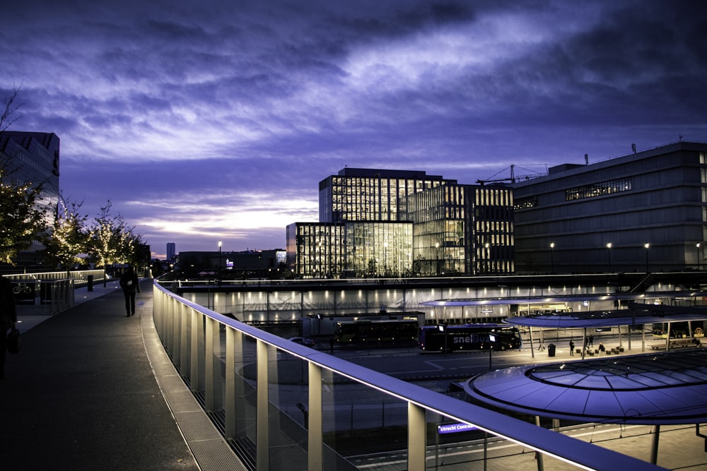 city buildings under blue sky during night time