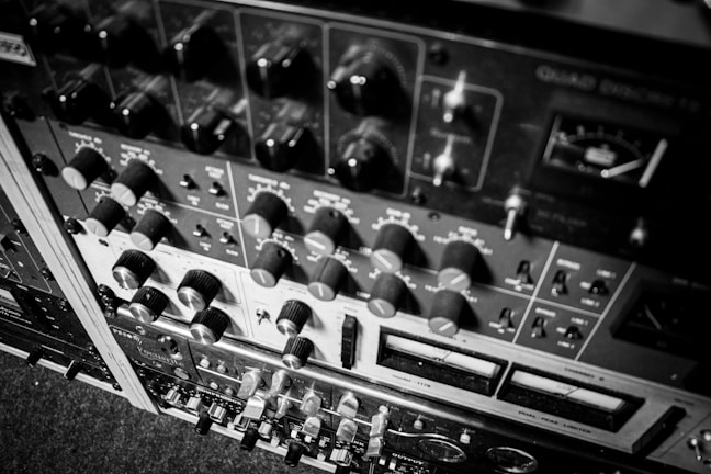 Various professional audio devices arranged neatly on a workbench