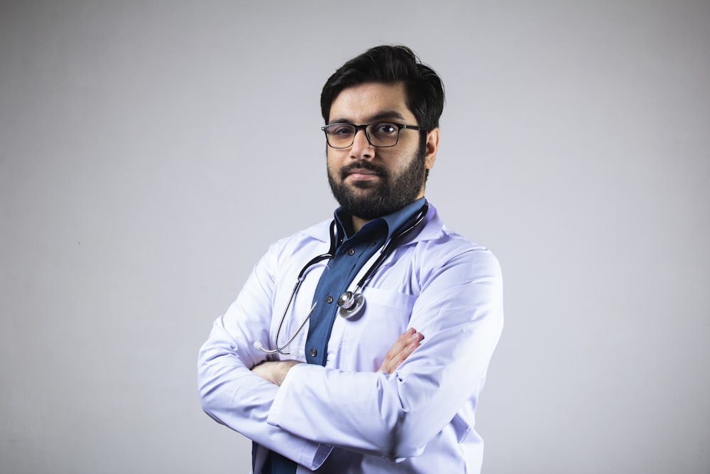 man in white dress shirt wearing black framed eyeglasses