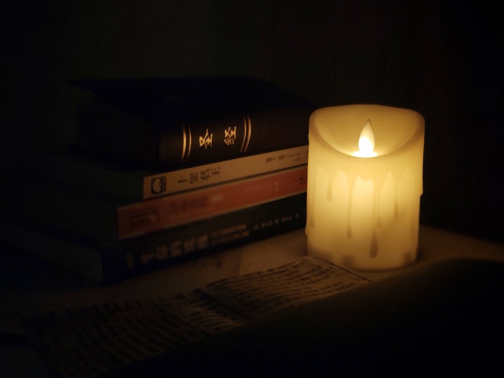 yellow candle on brown wooden table