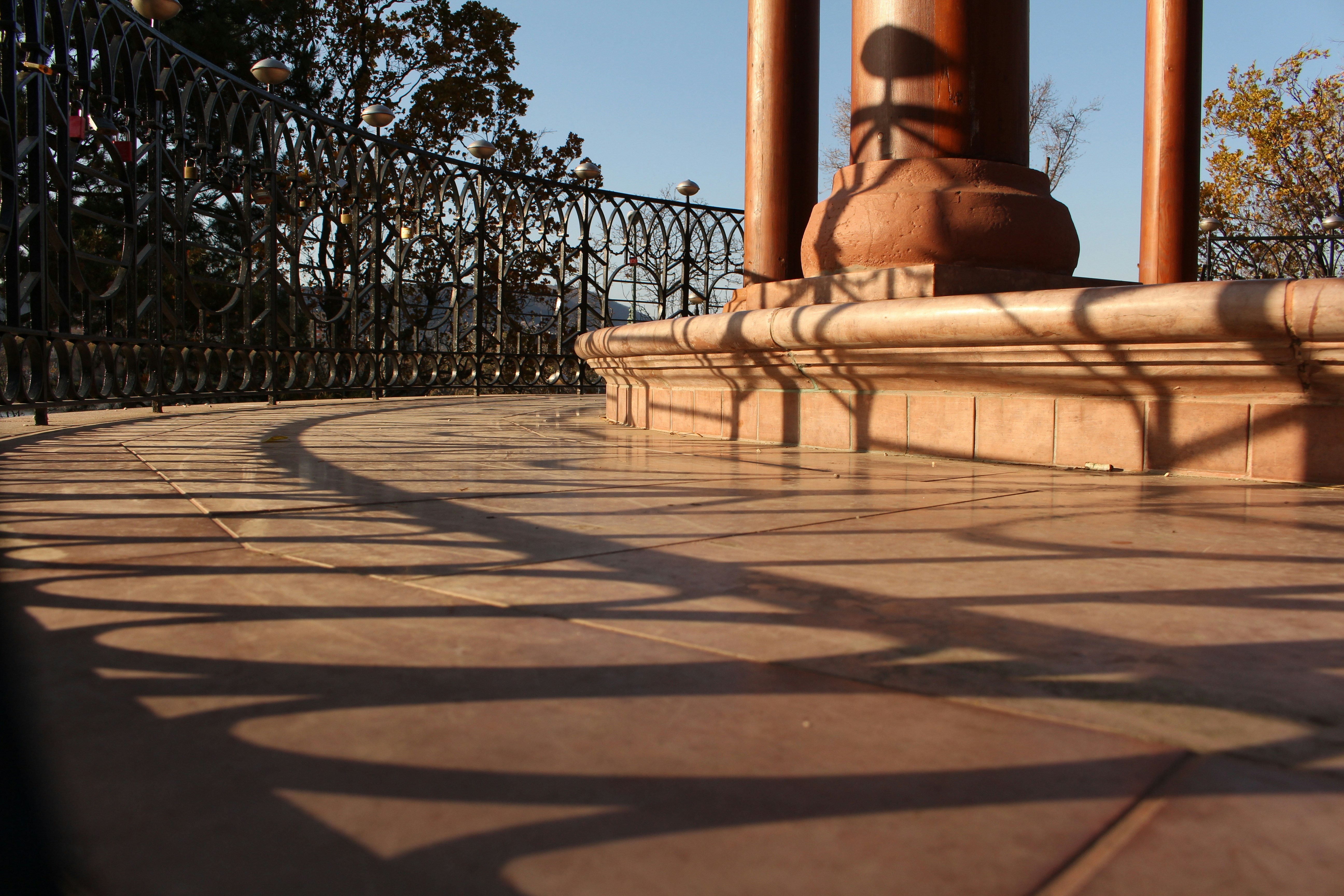 black metal fence on brown concrete floor
