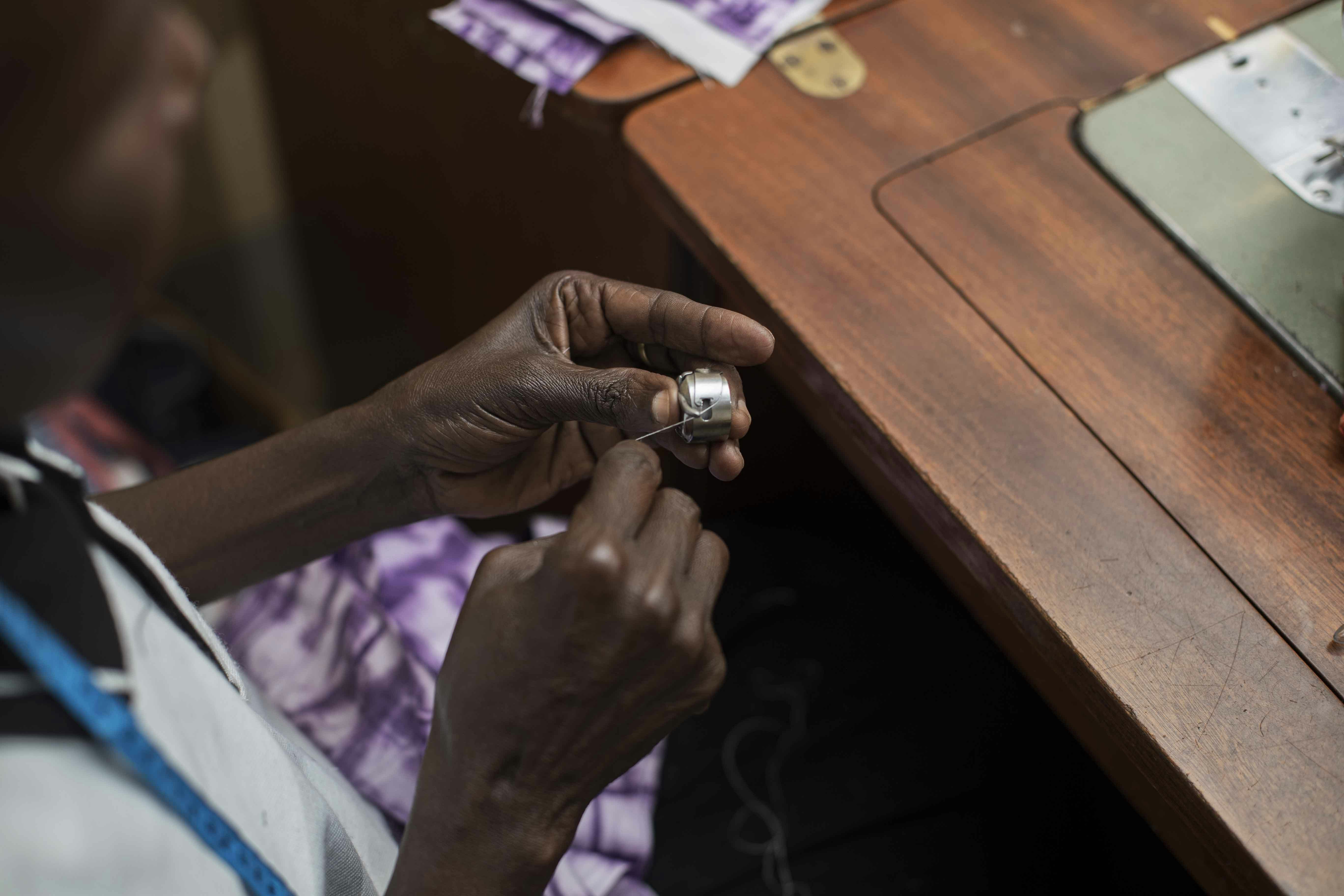 person wearing silver ring and silver ring