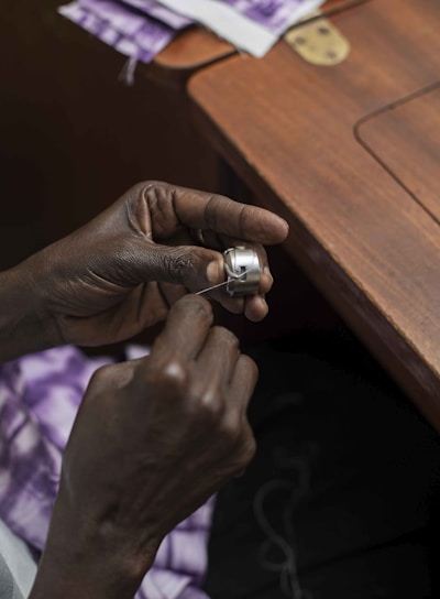 person wearing silver ring and silver ring