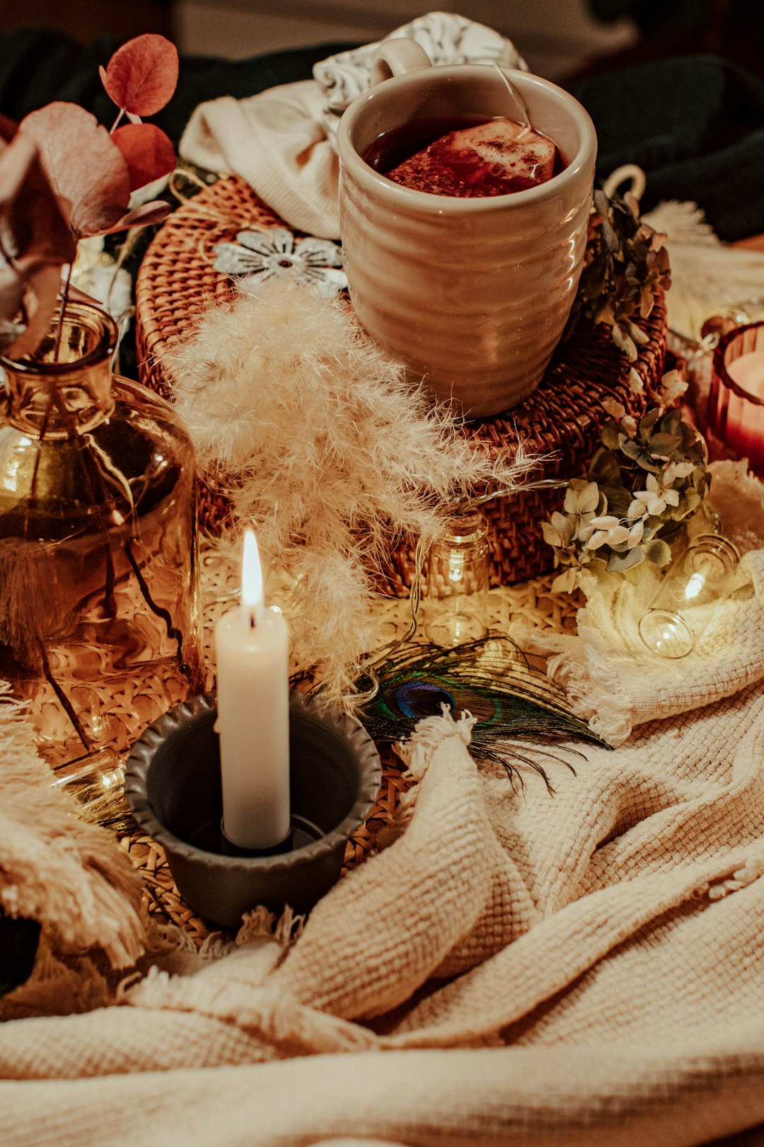 white pillar candle on brown wooden candle holder