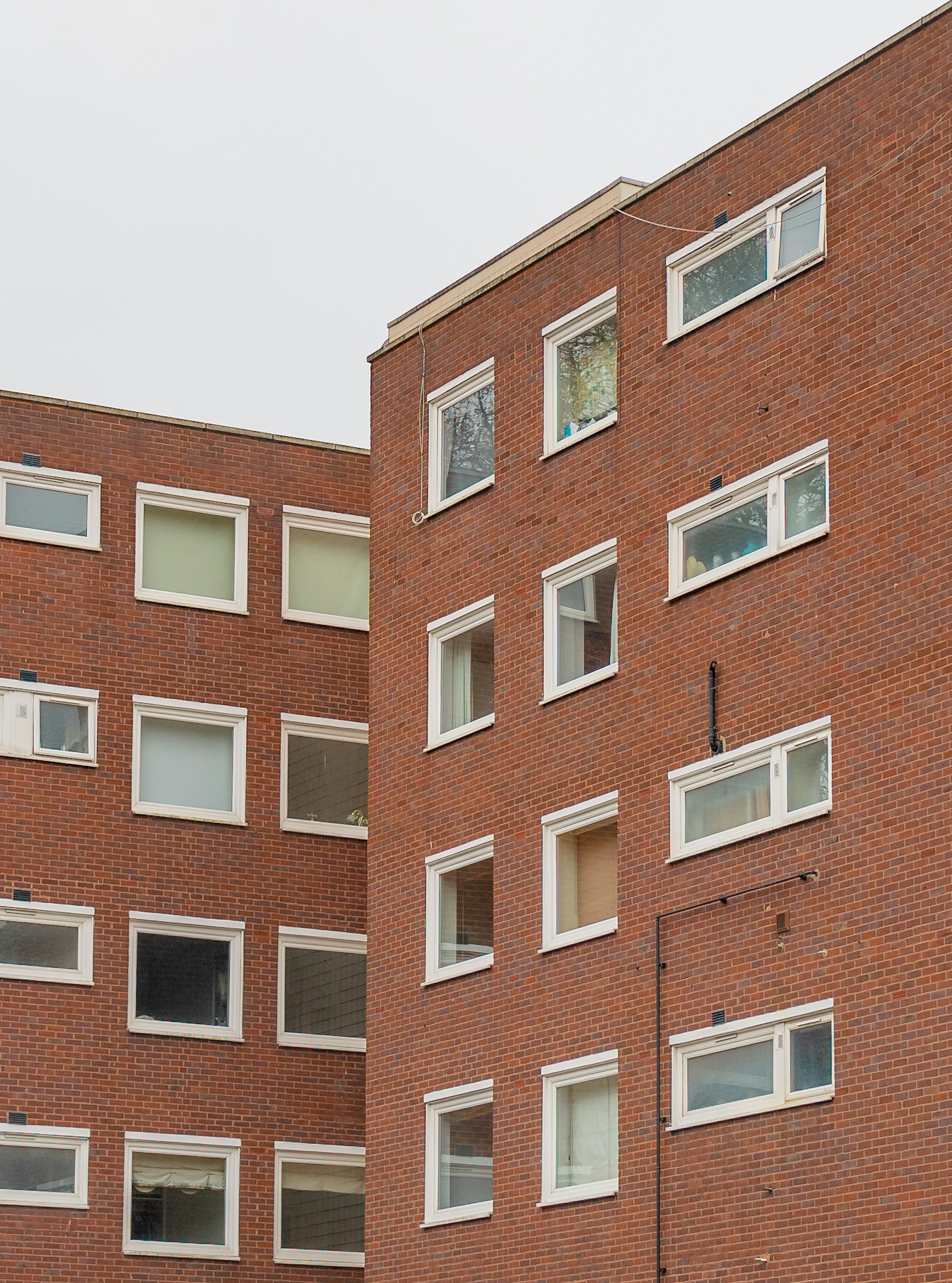 brown brick building with glass windows