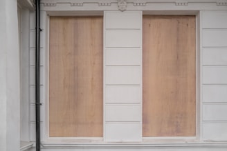 boarding up windows to homes and businesses