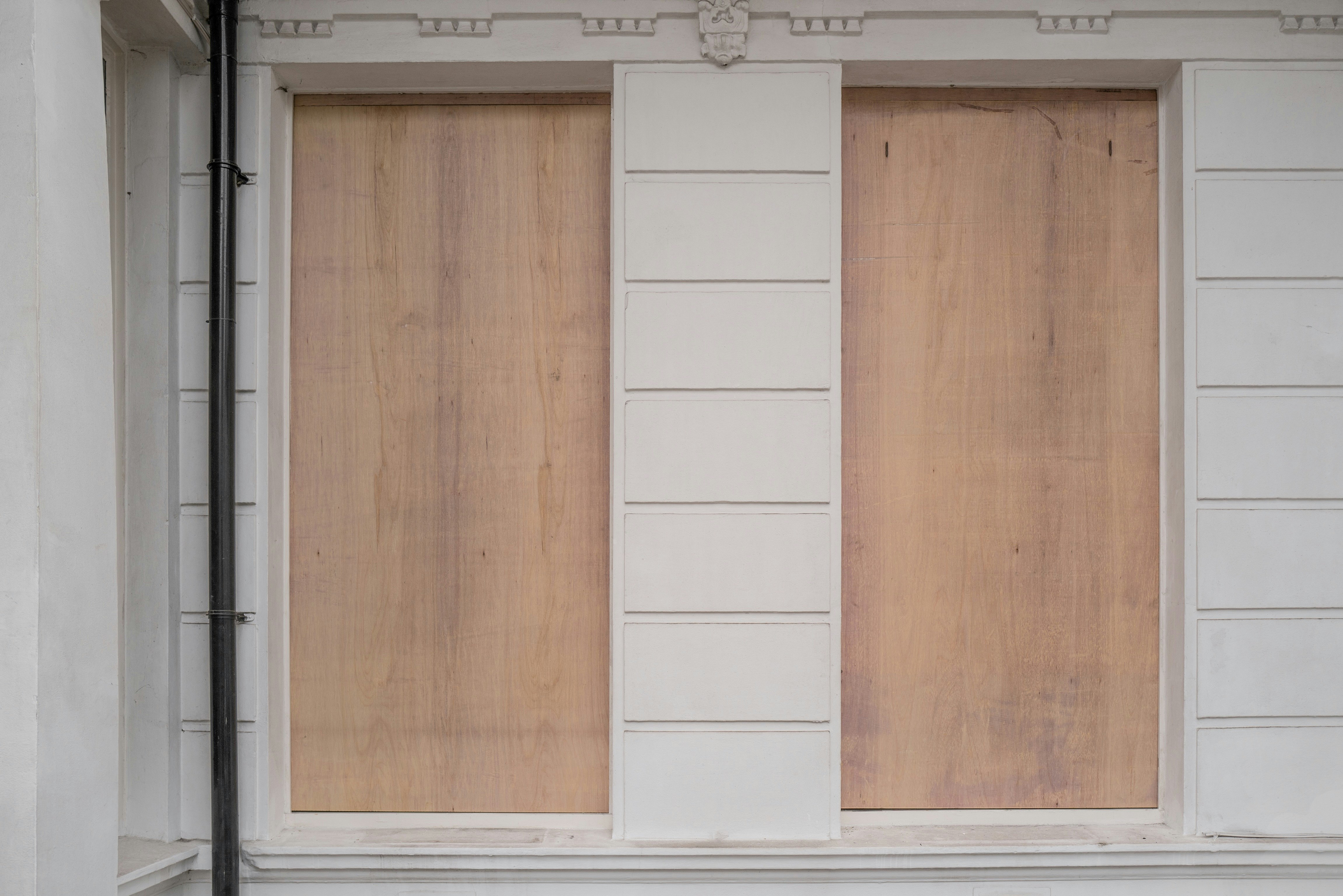 white wooden door with white wooden frame