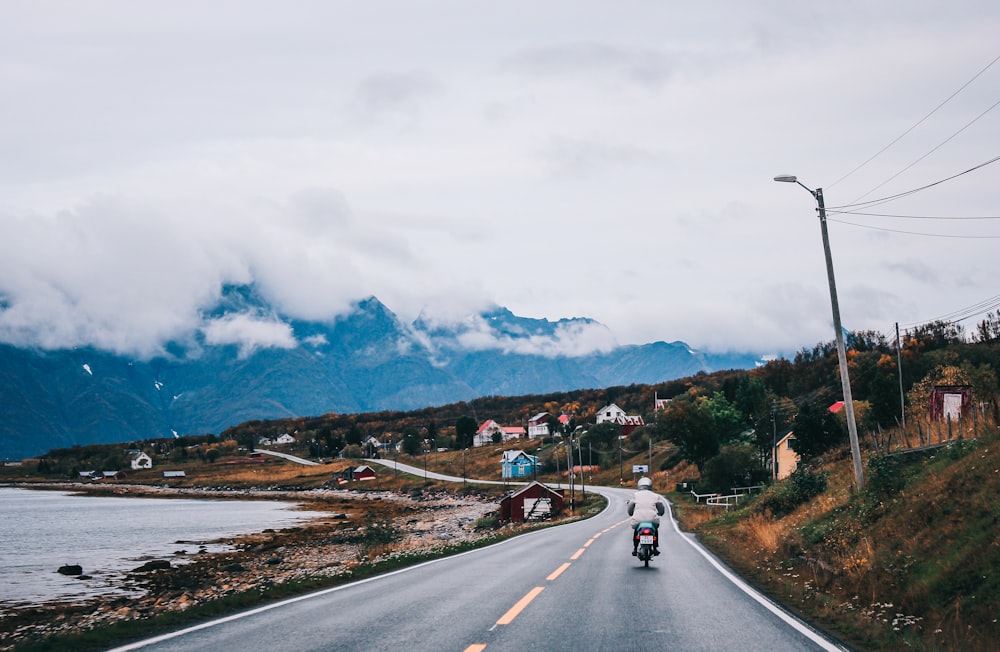 white car on road near mountain during daytime