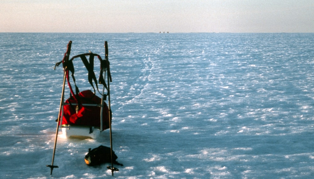 a small boat in the middle of a large body of water