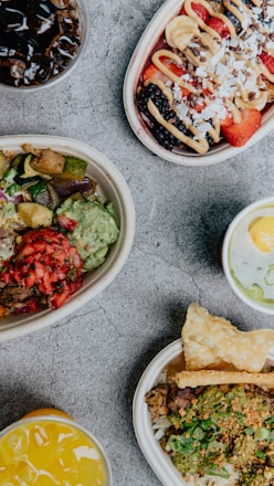 A vibrant buffet table filled with various healthy dishes and fresh ingredients.