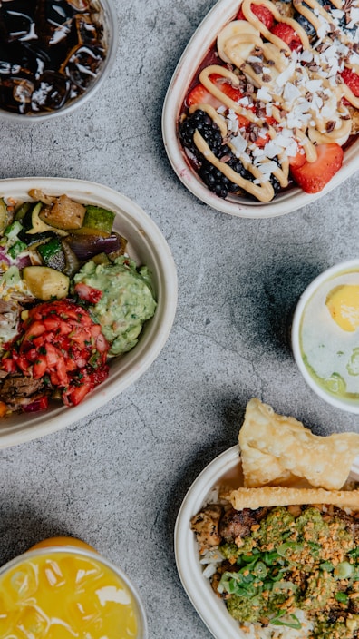 A vibrant assortment of colorful energy bites arranged on a wooden table.
