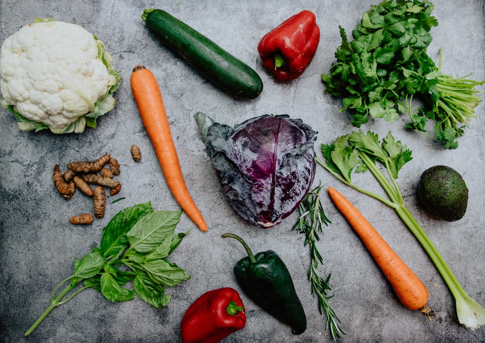 carrots and green vegetable on the ground