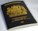 black and gold book on white table
