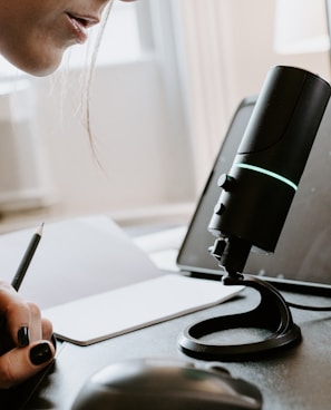 person holding black and green portable speaker