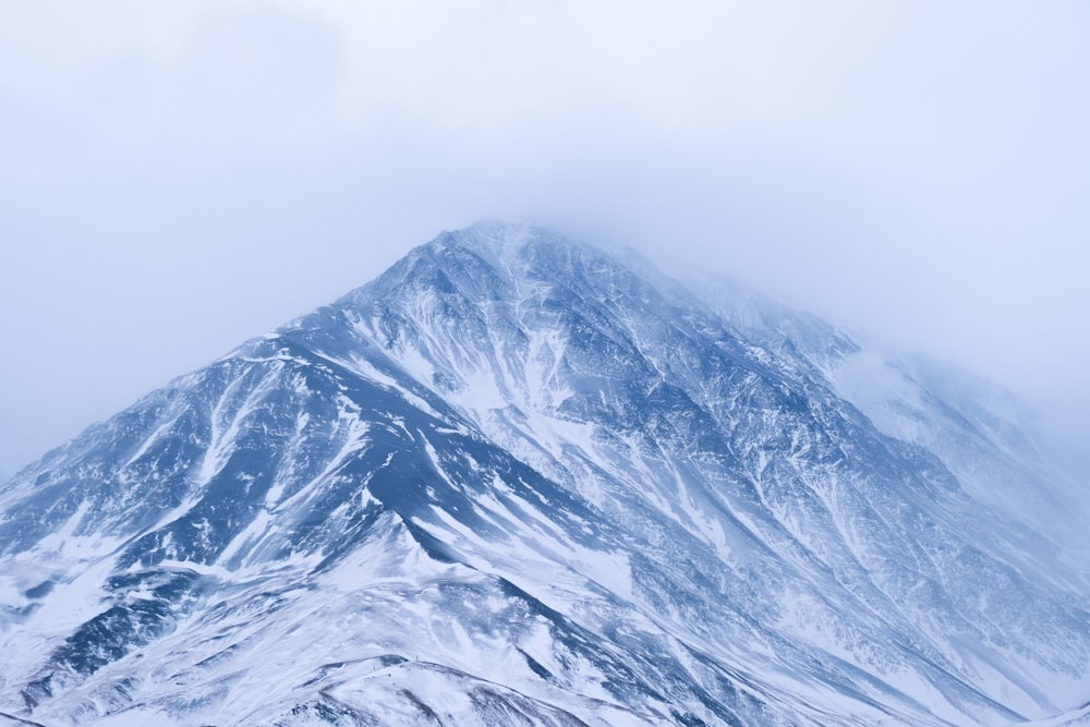 snow covered mountain during daytime