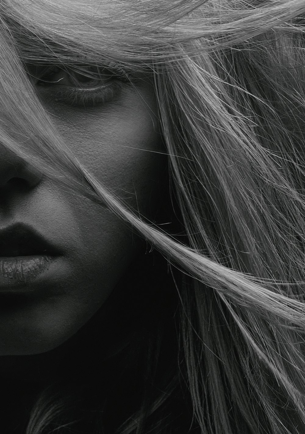 grayscale photo of womans face