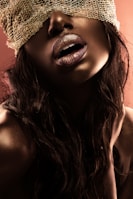 Artistic shot of a silk blindfold resting on smooth skin.